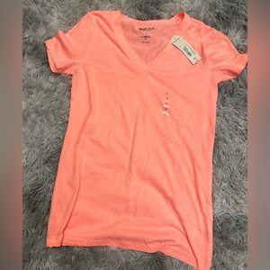 Bright melon colored T-shirt